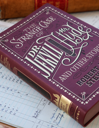 a book on top of other books on a table