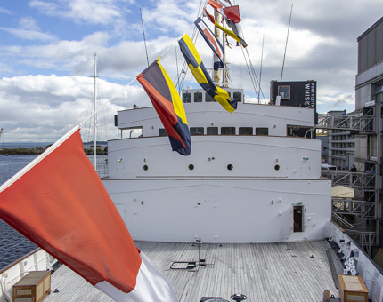 A view of The Bridge from the cherry picker with dress flags. 