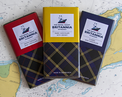 Three bars of Britannia chocolate with tartan wrappers. 