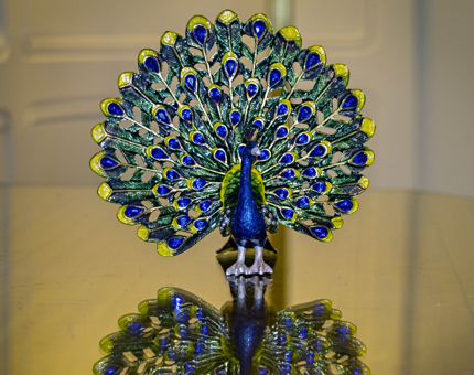 An enamel peacock trinket box.
