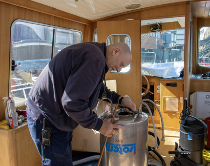 A man working on the calorifier on Royal Nore. 