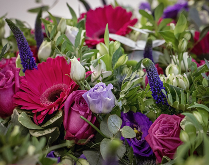 An arrangement of pink and white flowers. 