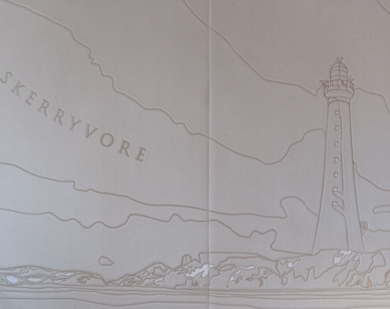 A fabric board decorated with an illustration of Skerryvore lighthouse. 