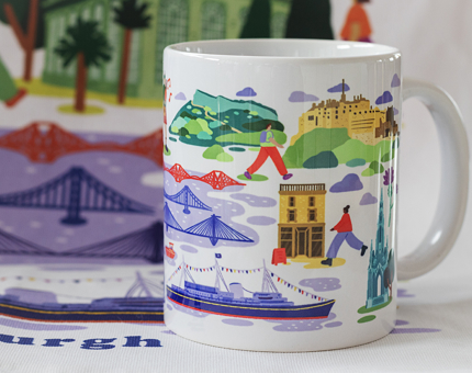 A brightly coloured mug illustrated with landmarks of Edinburgh, including Britannia. 