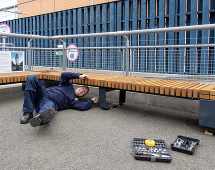 Paul, Facilities Officer, fitting a new seating area on the quayside.