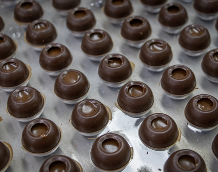 Delicious salted caramel truffles are prepared for petits fours served aboard Fingal.