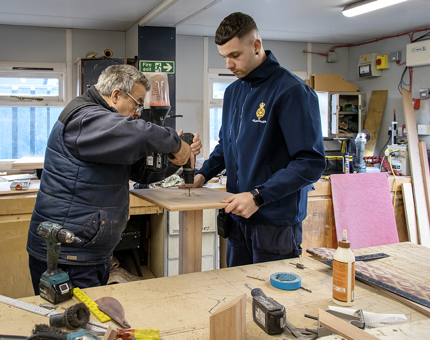 Gary and Steven manufacturing a plinth for evening events.