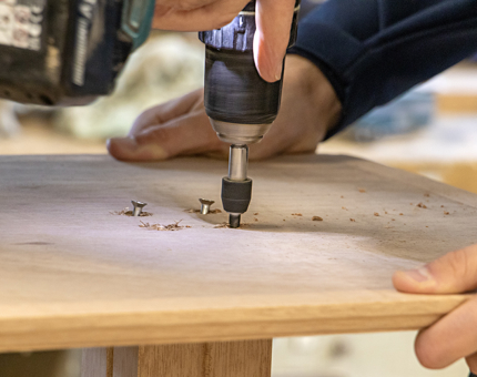 A closer look at fitting the screws in place.