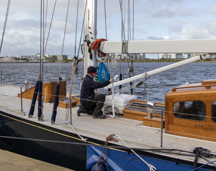 Nico installing the lifeboat aboard Bloodhound.