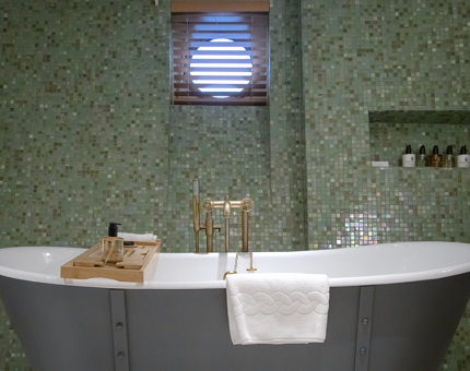 A roll-top bath in a duplex cabin at Fingal.  