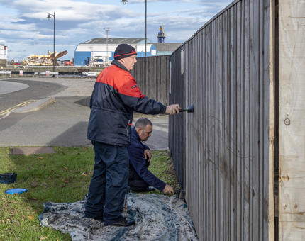 Painting Fingal car park fence