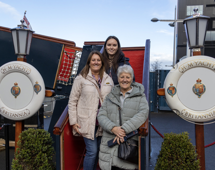 Three visitors stand at the bottom of the Royal Brow