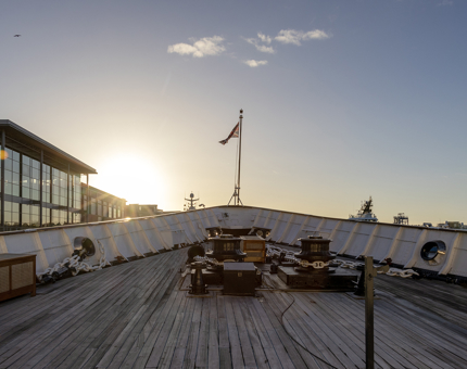 The sun setting on the Foc's'le Deck at the bow of the ship. 