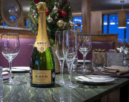 A bottle of Champagne on a dining table in The Lighthouse Restaurant & Bar. 