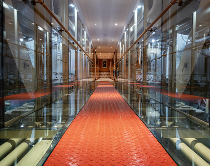 The glass-walled walkway over the Engine Room on Fingal. 