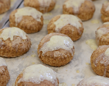 A tray of cheese scones fresh out of the oven. 