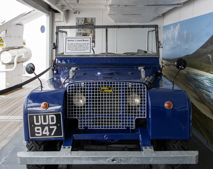A blue Land Rover car in the onboard Garage.
