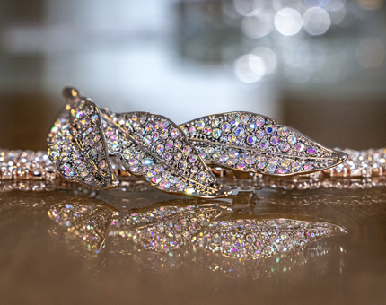 A sparkly leaf brooch. 