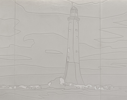 The detail of a embroidered design of a lighthouse on a cream leather headboard in a cabin at Fingal. 