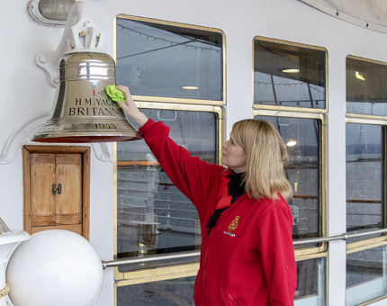 A Housekeeper polishing Britannia's bell.