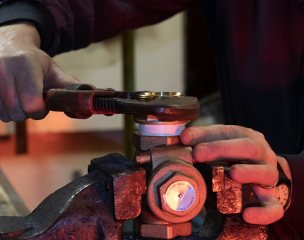 A close-up of the valve being stopped in the worktop vice.