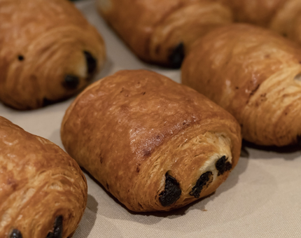A tray of pain au chocolat pastries.