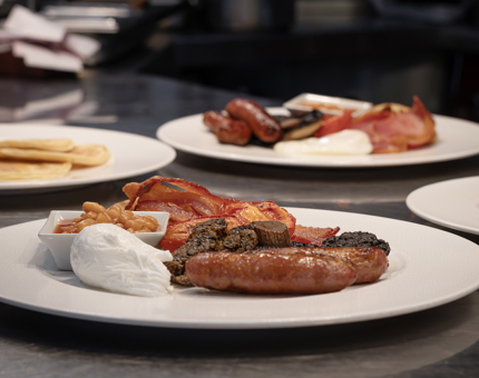 Plates of cooked breakfasts.
