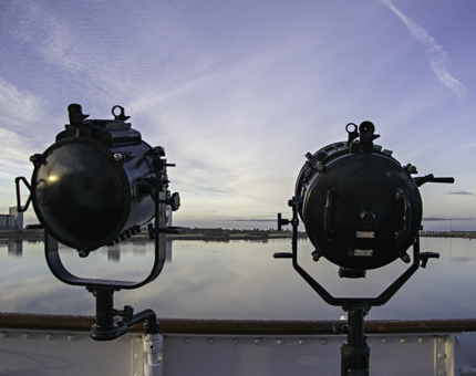 Two large black mounted lamps on the Bridge.