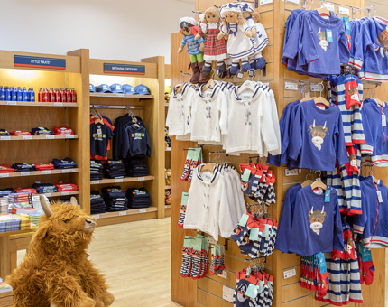 The children's corner of the Gift Shop containing cute outfits and cuddly toys.