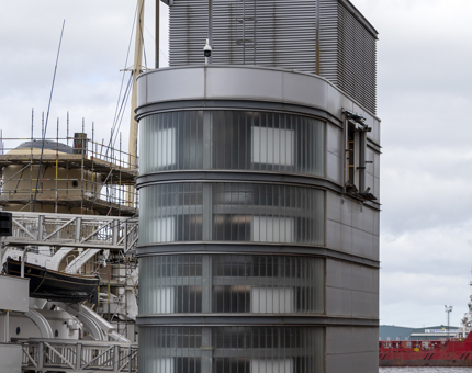 Scaffolding around the ship's funnel and the visitor lift tower. 
