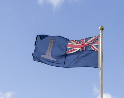 The ensign of the Northern Lighthouse board with a union jack and lighthouse emblem.