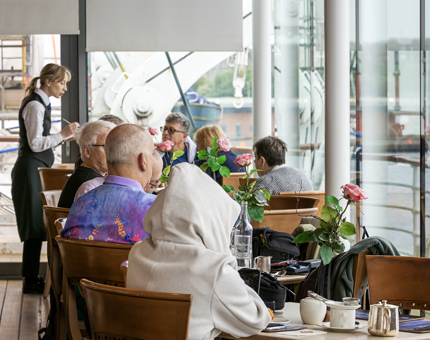 Waiter serving in the busy Royal Deck Tea Room