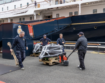 Four men moving engines