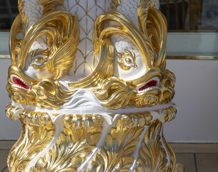 Detail of gold dolphins on the compass binnacle on the Verandah Deck.