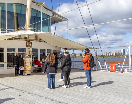 Visitors taking photos on the Verandah Deck.