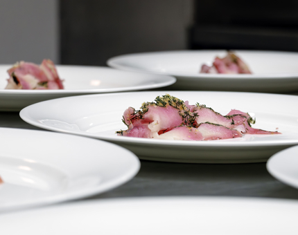 A beetroot and halibut dish is being plated up in the Galley.