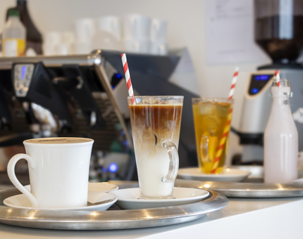 A tray of summer drinks in the Royal Deck Tearoom, including an iced coffee, iced tea and a milkshake.
