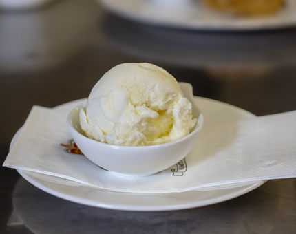A dish of vanilla ice cream.