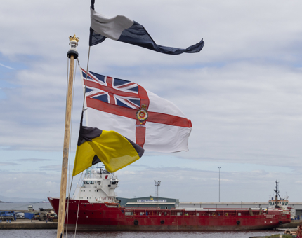 Brightly coloured flags flying in the wind.