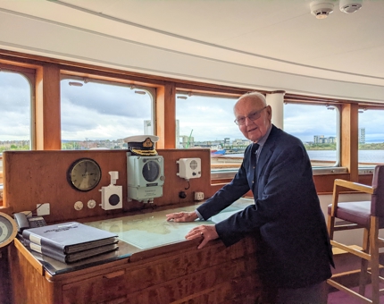 A man standing in the Chart Room. 