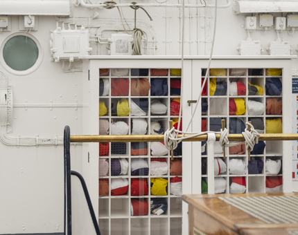 The Flag Box containing many different brightly coloured flags. 