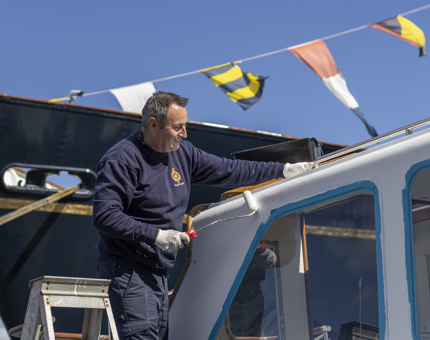 Another view of the Activity Boat being painted.