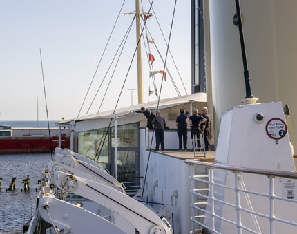 A group of the Maintenance team are inspecting the canopy on the Tearoom roof. 