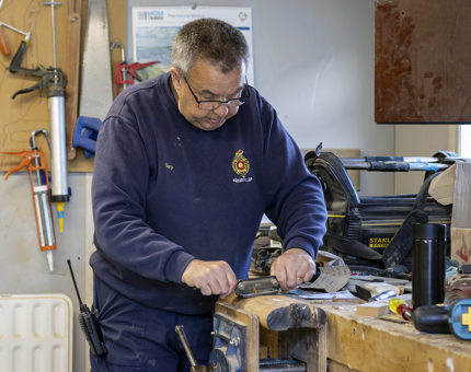 A member of the Maintenance team is finishing a new set of handrails for Fingal.