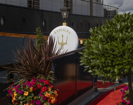 The entrance brow of Fingal. There are flowers and a red carpet. 