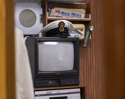 A television and newspapers in the CPO's Cabin.