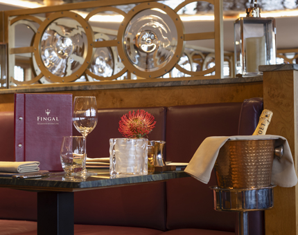 A table set with a bottle of Champagne in Fingal's Art Deco style Lighthouse Restaurant & Bar. 