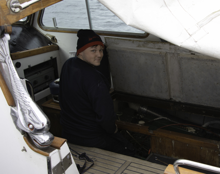 Ben working on the starboard engine of the Fast Motor Launch.