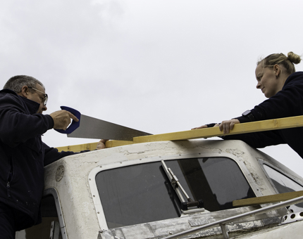 Gary and Steph making bracing to cover the activity boat ready for the cold winter months.
