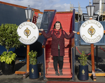 A woman posing for a photograph at the Royal Brow. 